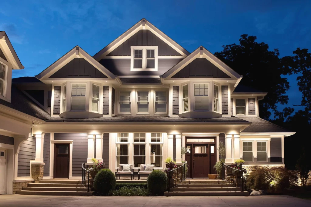 Even soffit downlighting and wall-wash on a two-story home in Gainesville, FL, with path and entry lighting for safety and curb appeal.